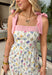 Fresh, colorful, and made for sunny days! This neutral tiered dress features a vibrant floral print with pops of pink, yellow, purple, blue, and green for a cheerful, eye-catching look. The flowy tiered silhouette adds beautiful movement, while the pink and white stripe trim throughout gives it an extra playful touch. The adjustable tie straps not only add a sweet detail but also allow for a customizable fit. Lightweight and fully lined, this dress is perfect for everything.
