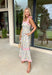 Fresh, colorful, and made for sunny days! This neutral tiered dress features a vibrant floral print with pops of pink, yellow, purple, blue, and green for a cheerful, eye-catching look. The flowy tiered silhouette adds beautiful movement, while the pink and white stripe trim throughout gives it an extra playful touch. The adjustable tie straps not only add a sweet detail but also allow for a customizable fit. Lightweight and fully lined, this dress is perfect for everything.
