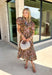 Fall florals have never looked so timeless! This beautiful brown midi dress features a delicate floral print with eyelet detailing that adds texture and charm to every look. The ruffled band collar and flattering v-neckline create an effortlessly feminine silhouette, while the button front brings a classic touch. Finished with short puff sleeves, side pockets, and a fully lined design, this dress is as practical as it is beautiful.