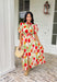 Bright blooms and easy details make this neutral short sleeve midi dress by Entro a spring favorite. Featuring a bold tulip floral print with vibrant pops of red, green, and orange, it brings cheerful color to a soft, wearable base. Puff sleeves add a feminine touch, while the front zipper closure gives it a modern, effortless feel. An elastic waist creates a flattering fit, and the full lining keeps it comfortable all day long. This is the kind of dress that does all the work—just add sunshine.