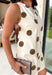 Classic polka dots never go out of style, and this charming dress from Day + Moon is the perfect blend of timeless style and feminine details. Designed with a soft cream backdrop and a rich brown polka dot print, this sleeveless dress is effortlessly chic for any occasion. The brown tie details at the top add a sweet, eye-catching touch, while the back zipper closure creates a flattering fit. 