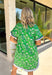 This green floral dress is such a fresh and fun pick for summer! The white floral print keeps it light and easy, while the navy and baby blue trim adds the perfect pop of contrast that makes this one stand out. The short sleeves and breathable cotton fabric keep it comfortable for warm days, and the fully lined design makes it an easy grab-and-go option. Whether you're heading to brunch, church, or a weekend outing, this dress makes getting ready feel effortless. 
