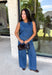 Double denim has never been easier with this matching two-piece set from Tres Bien. The sleeveless medium wash denim top features contrasting tan stitching throughout, giving the classic denim look a little extra detail. Coordinating wide leg jeans complete the set with an easy, relaxed silhouette, while the elastic waistband and adjustable self-tie detail keep the fit comfortable throughout the day. 
