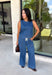 Double denim has never been easier with this matching two-piece set from Tres Bien. The sleeveless medium wash denim top features contrasting tan stitching throughout, giving the classic denim look a little extra detail. Coordinating wide leg jeans complete the set with an easy, relaxed silhouette, while the elastic waistband and adjustable self-tie detail keep the fit comfortable throughout the day. 