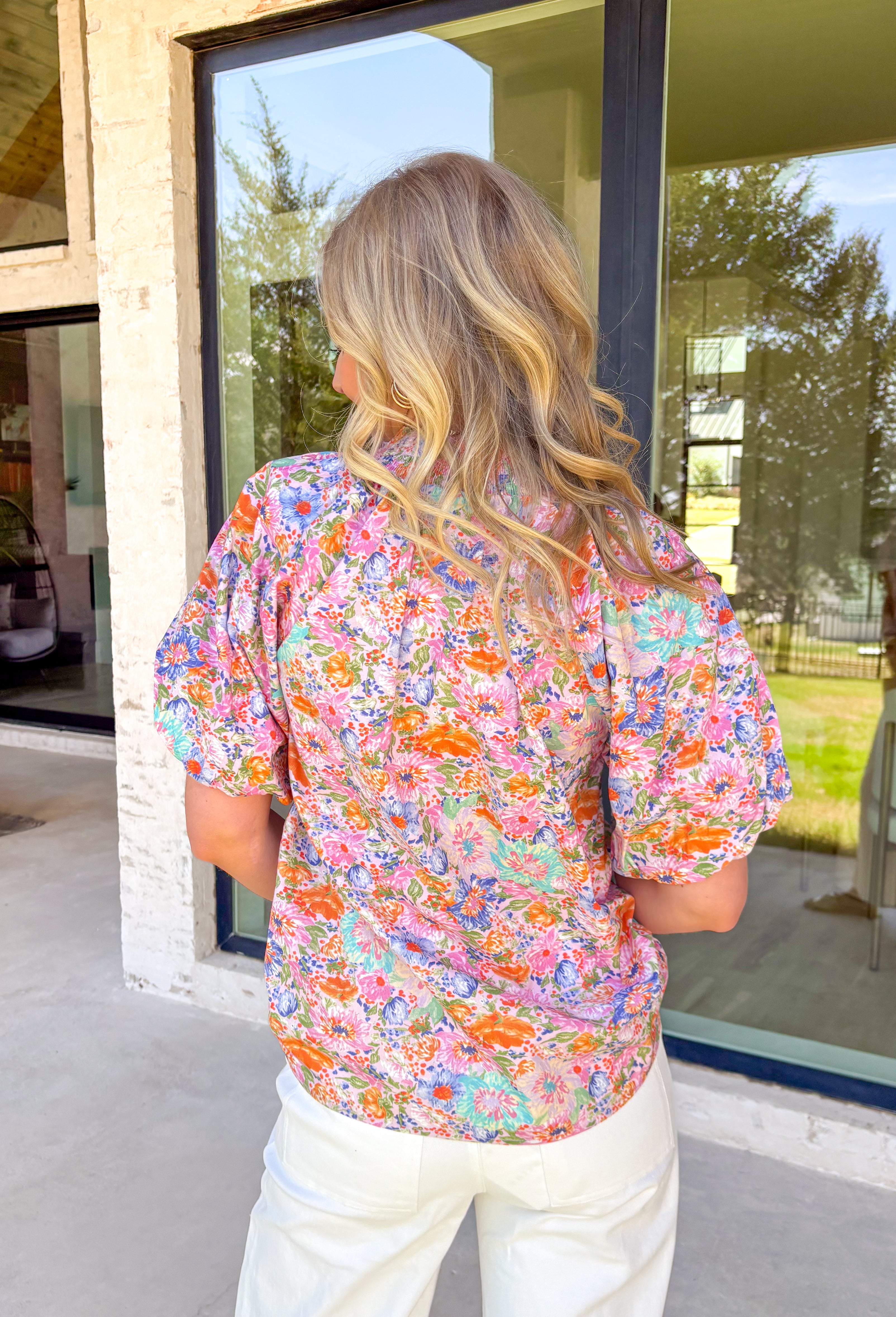 This lilac short sleeve top by Umgee is the prettiest little burst of spring color! Covered in a cheerful floral print with pops of blue, orange, green, and pink, it’s the kind of top that instantly brightens up your whole outfit (and your mood). The smocked neckline adds a comfy, flattering fit with a sweet touch of texture, while the puff sleeves give it that feminine shape we love for the season. 