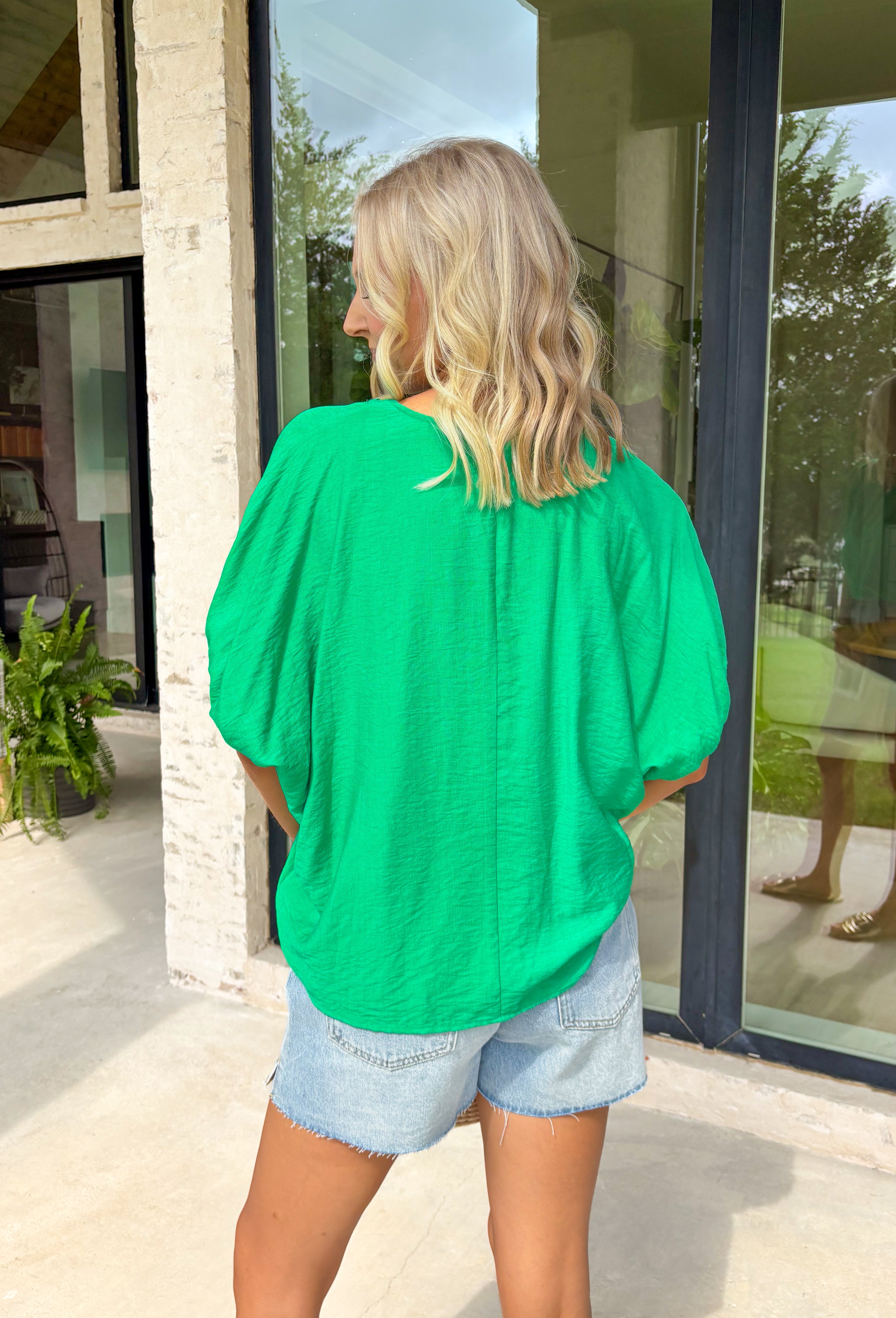 Soft, breezy, and effortlessly polished, this green dolman top by Entro is the perfect spring go-to. The relaxed dolman silhouette gives it an easy, flowy fit, while the v-neck accent with trenza detailing adds a subtle touch of texture that elevates the whole look. Lightweight and breathable, it’s an effortless piece that works for everyday wear, from casual errands to lunch plans.