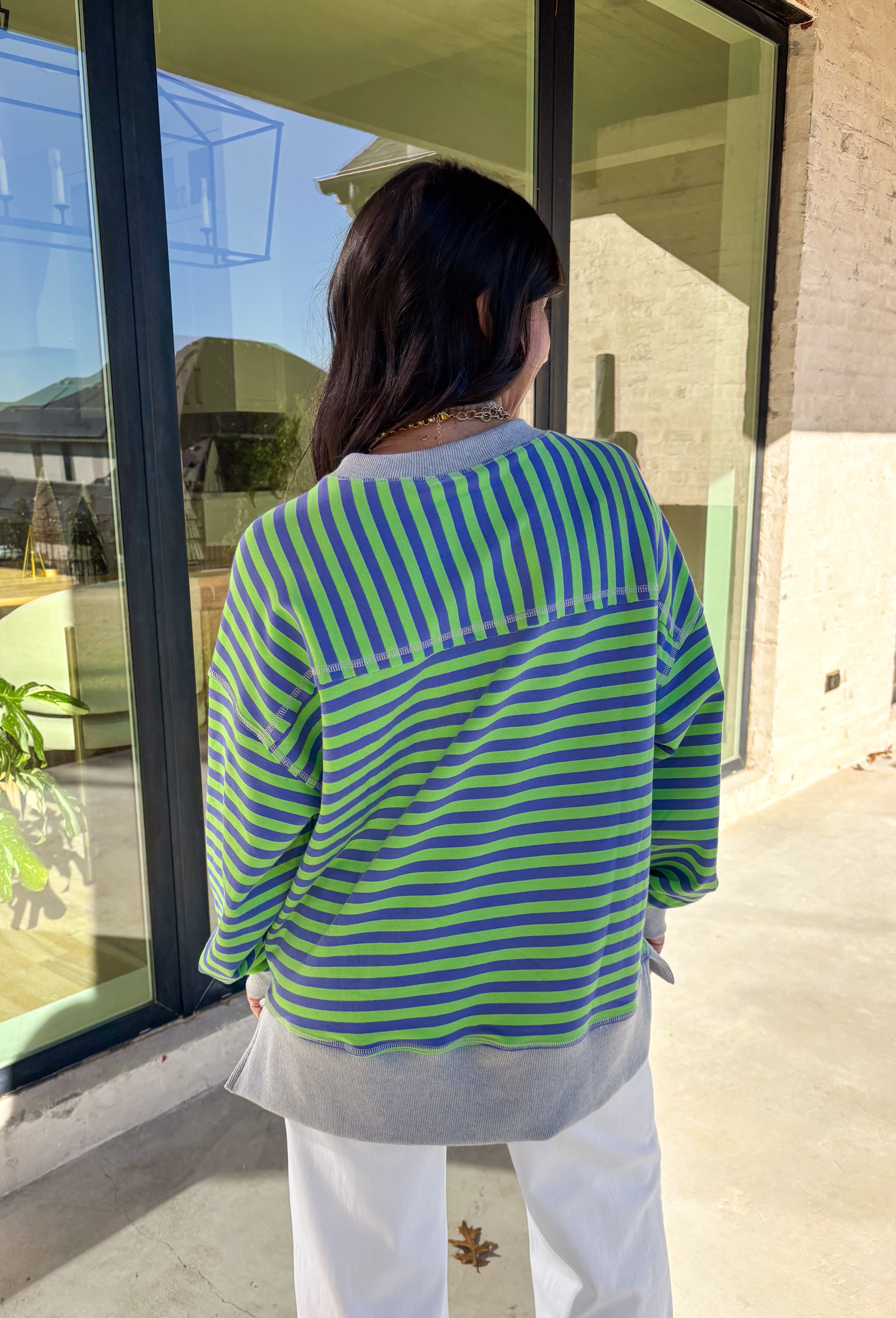 Bring a fresh pop of color to your spring wardrobe with this lightweight striped pullover by New In. The lime green and blue stripes add a cheerful touch, while the soft gray hem and cuffs give it a relaxed, casual finish. Perfect for breezy spring days, this comfy pullover pairs easily with denim or shorts for a laid-back, sunny-day look.