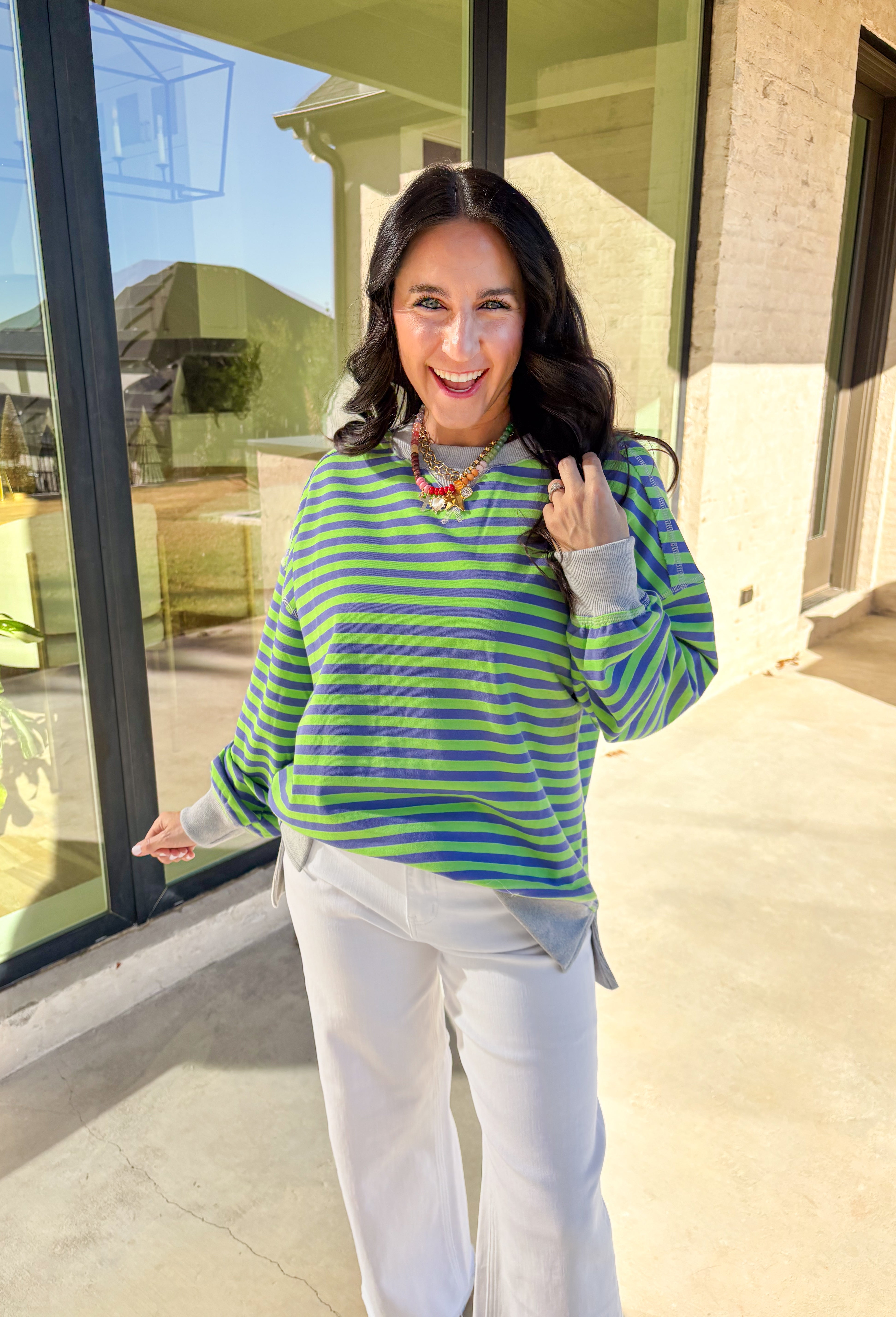 Bring a fresh pop of color to your spring wardrobe with this lightweight striped pullover by New In. The lime green and blue stripes add a cheerful touch, while the soft gray hem and cuffs give it a relaxed, casual finish. Perfect for breezy spring days, this comfy pullover pairs easily with denim or shorts for a laid-back, sunny-day look.