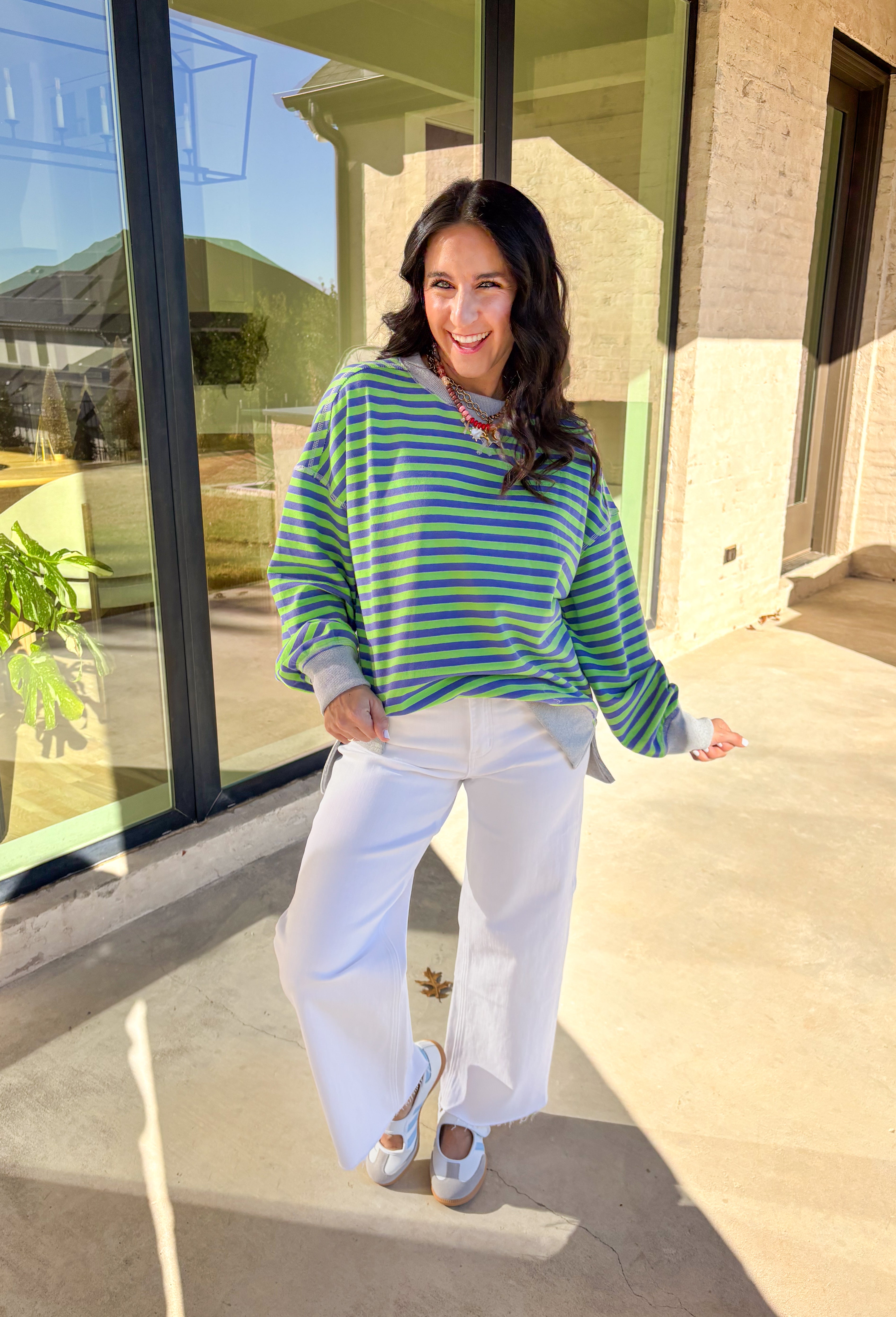 Bring a fresh pop of color to your spring wardrobe with this lightweight striped pullover by New In. The lime green and blue stripes add a cheerful touch, while the soft gray hem and cuffs give it a relaxed, casual finish. Perfect for breezy spring days, this comfy pullover pairs easily with denim or shorts for a laid-back, sunny-day look.
