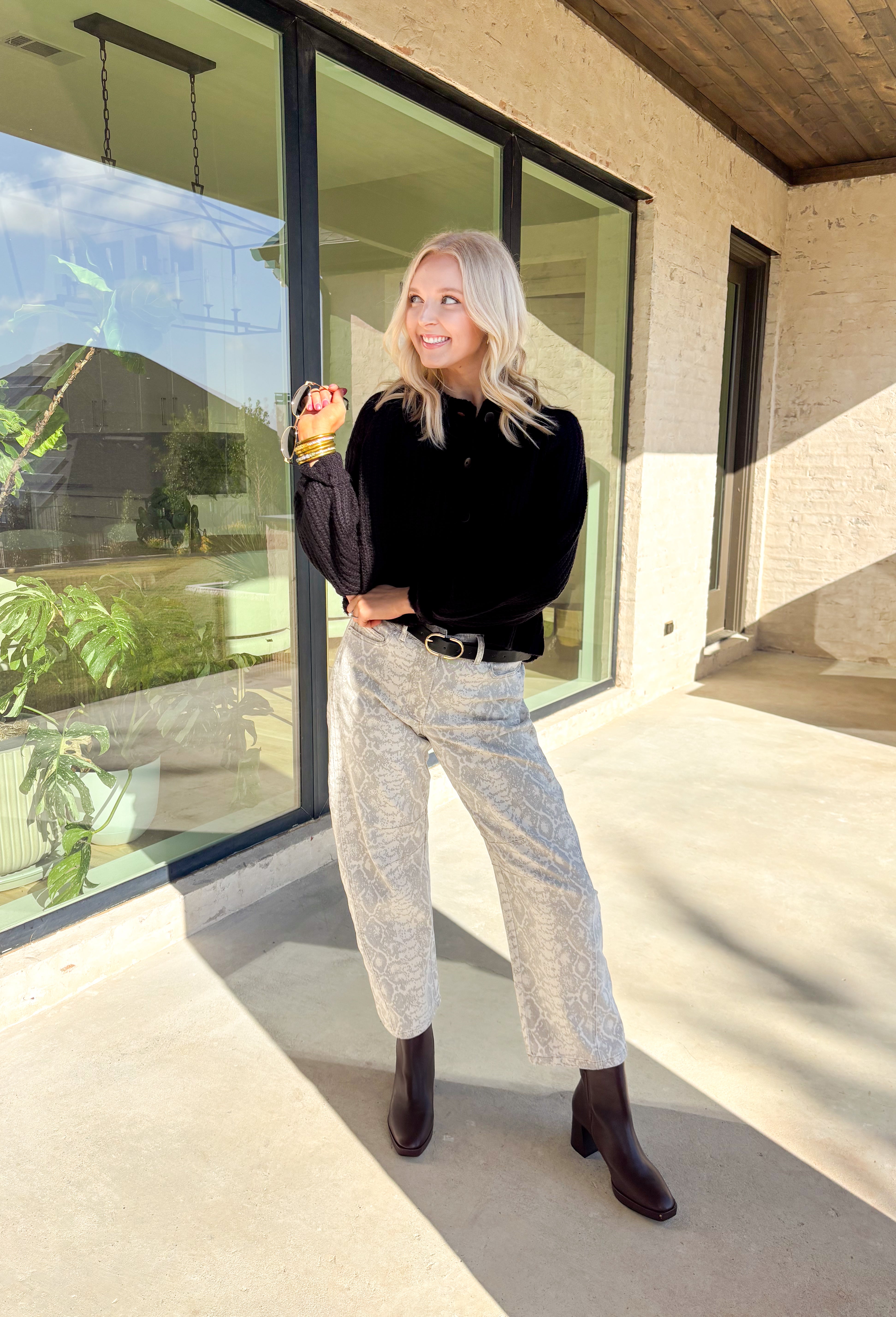 Keep it classic and cozy with this black knit button-down cardigan by Hyfve. The soft, medium-weight knit makes it perfect for layering through the seasons, while the timeless button-down design keeps it versatile for any occasion. Whether worn open over a tee or buttoned up with jeans, this cardigan is an easy go-to for effortless colder weather styling.