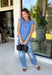 Layering season calls for pieces that can keep up with changing temperatures, and this blue sleeveless cardigan from Double Zero is ready for just that. The cozy knit brings plenty of texture and warmth, while the sleeveless design makes it easy to wear alone on milder days or layer over a long sleeve top as winter gets closer. A button-down front gives you multiple ways to style it, and the ribbed hem adds a classic sweater finish.