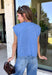 Layering season calls for pieces that can keep up with changing temperatures, and this blue sleeveless cardigan from Double Zero is ready for just that. The cozy knit brings plenty of texture and warmth, while the sleeveless design makes it easy to wear alone on milder days or layer over a long sleeve top as winter gets closer. A button-down front gives you multiple ways to style it, and the ribbed hem adds a classic sweater finish.