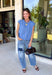 Layering season calls for pieces that can keep up with changing temperatures, and this blue sleeveless cardigan from Double Zero is ready for just that. The cozy knit brings plenty of texture and warmth, while the sleeveless design makes it easy to wear alone on milder days or layer over a long sleeve top as winter gets closer. A button-down front gives you multiple ways to style it, and the ribbed hem adds a classic sweater finish.