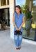 Layering season calls for pieces that can keep up with changing temperatures, and this blue sleeveless cardigan from Double Zero is ready for just that. The cozy knit brings plenty of texture and warmth, while the sleeveless design makes it easy to wear alone on milder days or layer over a long sleeve top as winter gets closer. A button-down front gives you multiple ways to style it, and the ribbed hem adds a classic sweater finish.