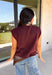 Layering season calls for pieces that can keep up with changing temperatures, and this dark cherry sleeveless cardigan from Double Zero is ready for just that. The cozy knit brings plenty of texture and warmth, while the sleeveless design makes it easy to wear alone on milder days or layer over a long sleeve top as winter gets closer. A button-down front gives you multiple ways to style it, and the ribbed hem adds a classic sweater finish. 
