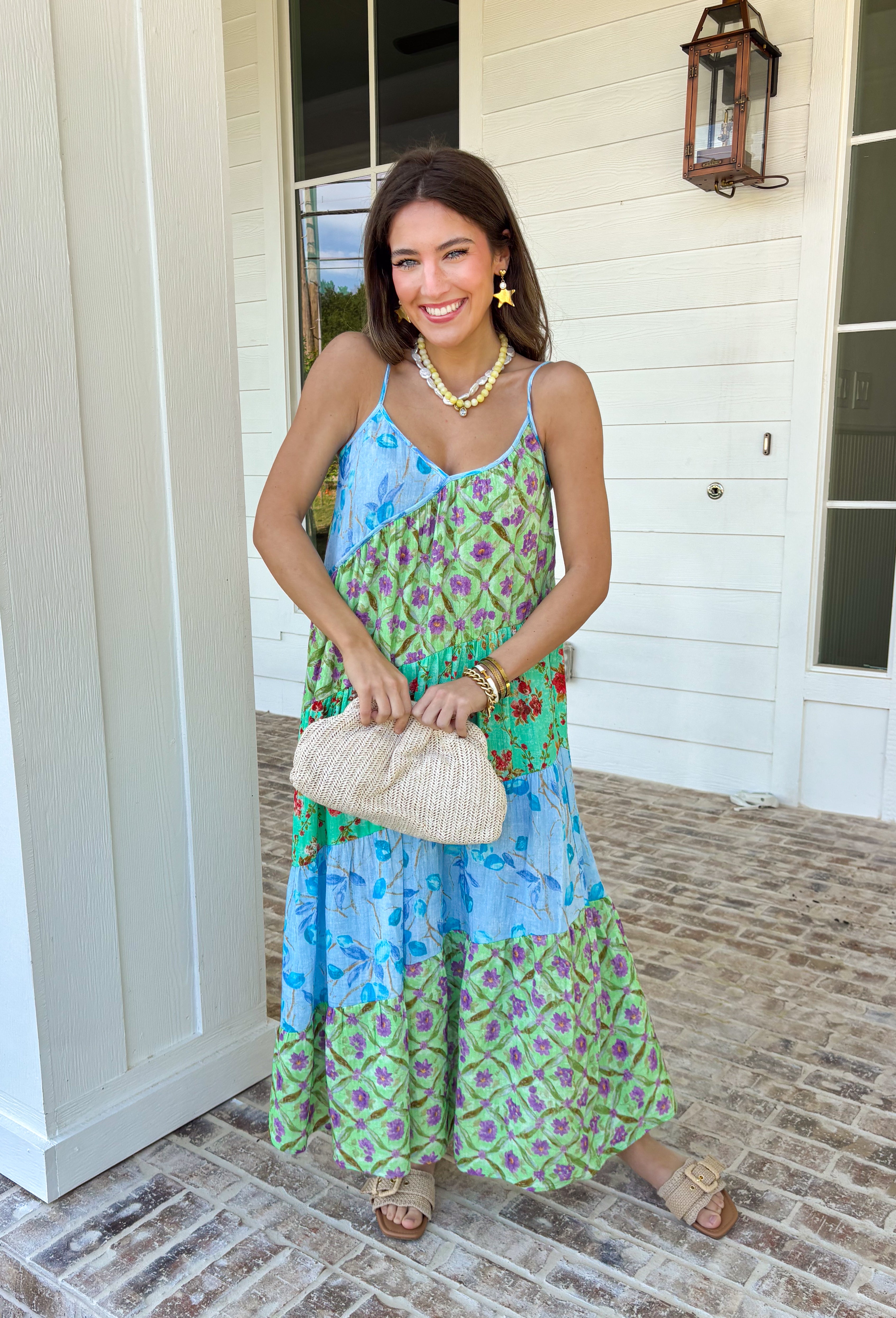 This tiered color block midi dress is made for sunshine-filled days and standout summer moments! Featuring a mix of green, purple, and blue with a floral print, it brings the perfect pop of color while still feeling easy and wearable. The tiered design gives it a flowy, flattering shape, and the adjustable straps with a v-neckline keep the fit comfortable and customizable. Lightweight in 100% cotton, it’s perfect for staying cool while looking put together.