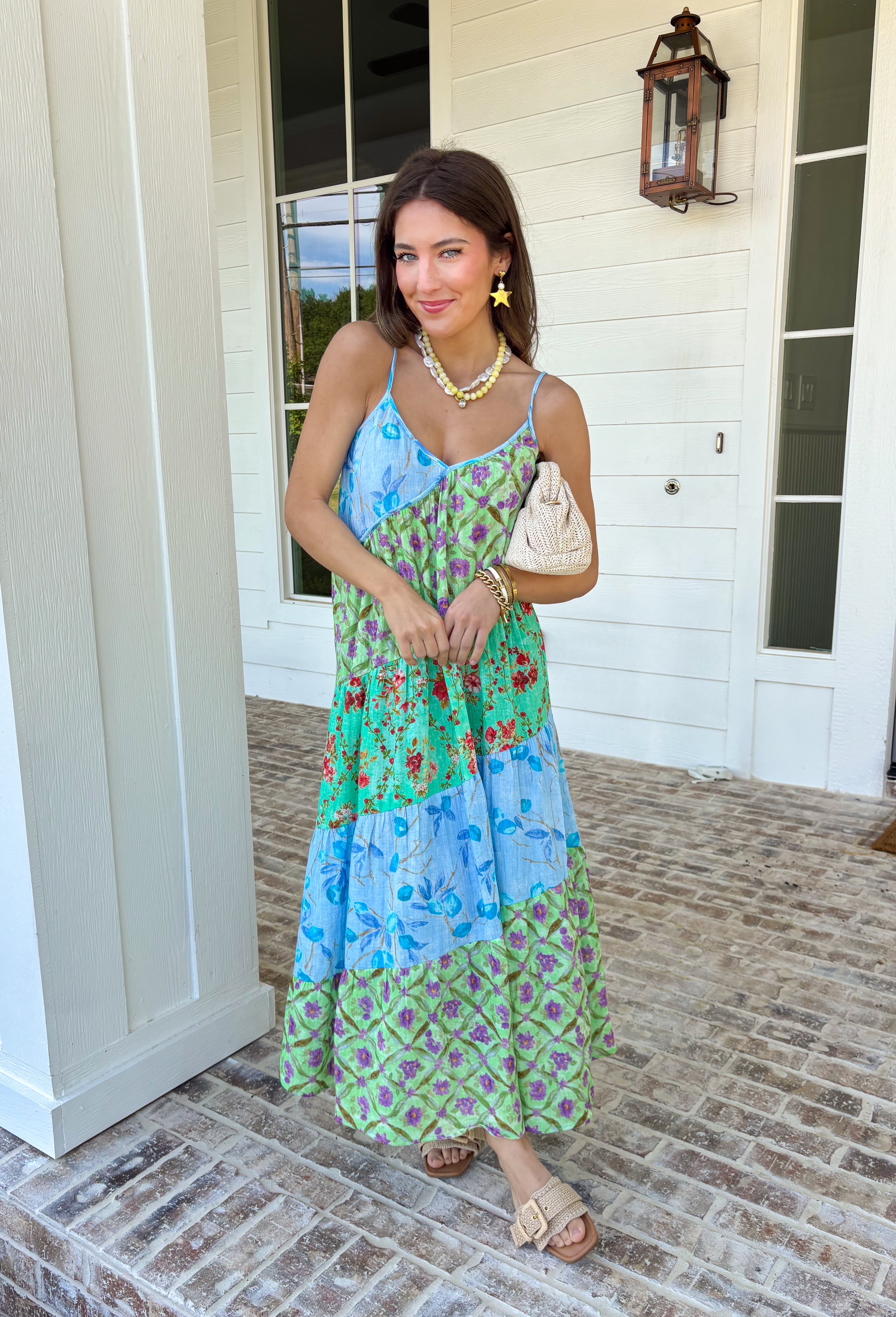 This tiered color block midi dress is made for sunshine-filled days and standout summer moments! Featuring a mix of green, purple, and blue with a floral print, it brings the perfect pop of color while still feeling easy and wearable. The tiered design gives it a flowy, flattering shape, and the adjustable straps with a v-neckline keep the fit comfortable and customizable. Lightweight in 100% cotton, it’s perfect for staying cool while looking put together.