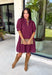 Elegant details and timeless style come together in this stunning embroidered dress from Entro. Designed in a rich wine hue, this textured dress is full of feminine charm. Delicate embroidery adds beautiful dimension, while the scalloped neckline, sleeves, and hem create a graceful, elevated finish. Puff sleeves bring a touch of romance, and the fully lined cotton fabric keeps you comfortable from morning to night.