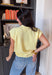 Soft, sunny, and so easy to style — this butter yellow short sleeve button down sweater is the perfect lightweight layer for transitioning seasons. The cheerful hue instantly brightens your outfit, while the knit texture keeps it feeling polished yet relaxed. Designed with a classic button down front and short sleeves, this sweater works beautifully worn on its own or layered over a tank.