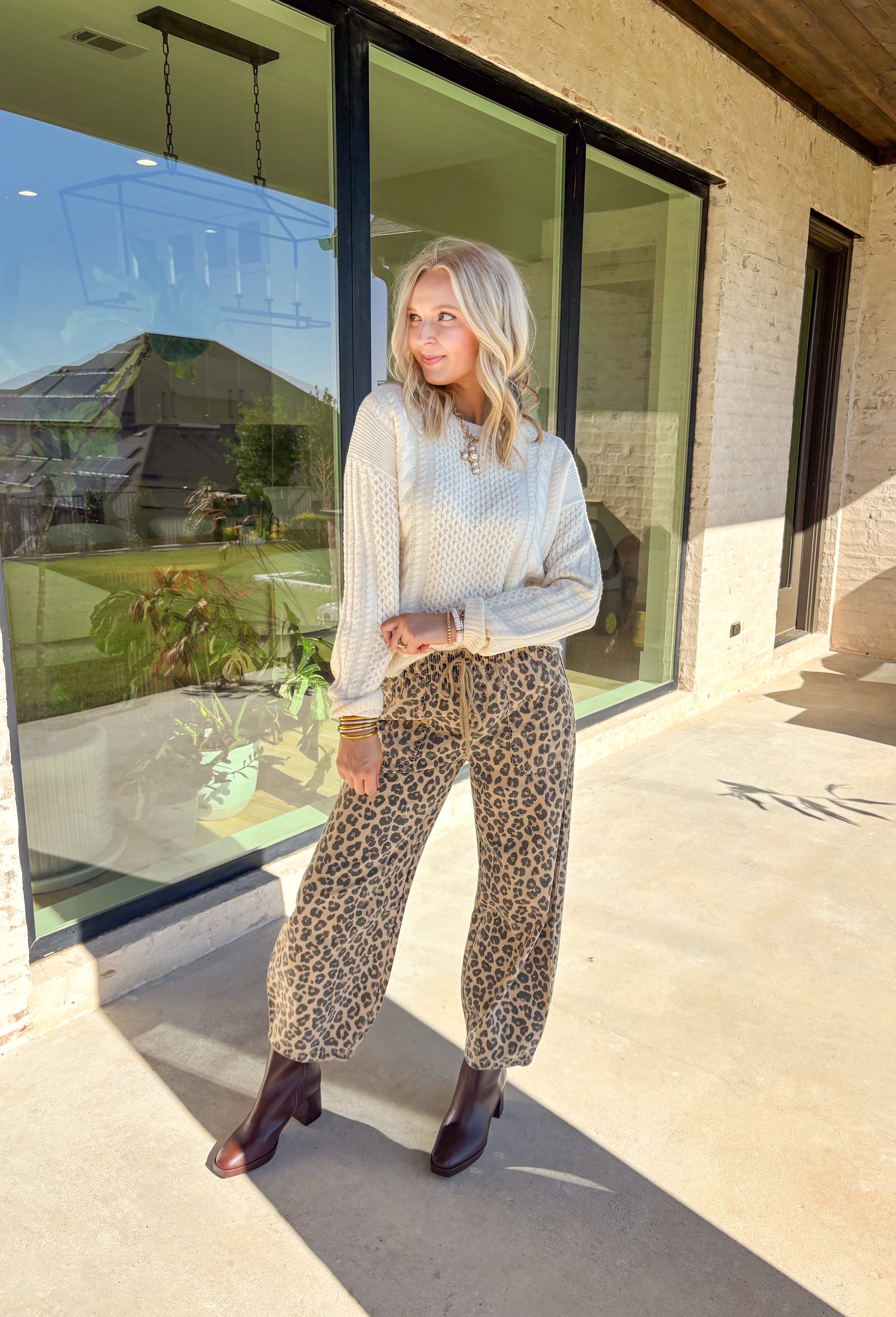 Bundle up in timeless comfort with this cream textured sweater. Crafted in a cozy knit, it’s the kind of piece you’ll want to live in all winter long. The soft fabric keeps it warm without being heavy, while the textured design adds dimension to a simple, versatile silhouette. Perfect for layering under coats or styling on its own, this sweater is a cold-weather staple you’ll keep reaching for.