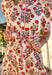 Fresh, fun, and full of spring charm, this cream short sleeve button-down dress by Entro is an easy standout. Featuring a red floral print throughout, it brings the perfect pop of color while still feeling effortless and wearable. Red and white striped trim accents the design for a playful contrast, and the matching self-tie waist gives it a flattering, adjustable fit. Finished with side pockets and a fully lined cotton feel, this dress is perfect for brunch, spring events, and sunny weekends.