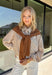 Get the polished look of layering without any extra effort in this chic top from Hyfve. Designed with a classic camel and white striped button-down base, this unique piece features a camel ribbed sweater overlay for a perfectly styled layered look in one easy top. The collared neckline and front pocket add timeless appeal, while the lightweight fabric keeps it comfortable for all-day wear. 