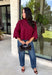 Rich merlot color makes this sweater top from Entro an instant favorite for the cooler months. The deep wine-inspired shade adds the perfect pop of seasonal color while still pairing easily with denim, cream, camel, and other autumn neutrals. A mock neckline gives it a classic look, while scalloped edges along the hem and sleeves add a sweet, unexpected finish. The ¾ length sleeves make it an easy transitional piece for warmer fall afternoons and chilly days ahead. 