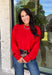 Nothing says cozy season like a classic red sweater, and this timeless knit from Double Zero is one you'll reach for again and again. Designed in a rich red hue, this effortlessly versatile sweater features exposed seam detailing that adds a modern touch to its classic silhouette. Ribbed trim at the neckline and cuffs provides a polished finish, while the soft knit construction keeps you warm and comfortable all day long. 