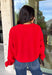 Nothing says cozy season like a classic red sweater, and this timeless knit from Double Zero is one you'll reach for again and again. Designed in a rich red hue, this effortlessly versatile sweater features exposed seam detailing that adds a modern touch to its classic silhouette. Ribbed trim at the neckline and cuffs provides a polished finish, while the soft knit construction keeps you warm and comfortable all day long. 