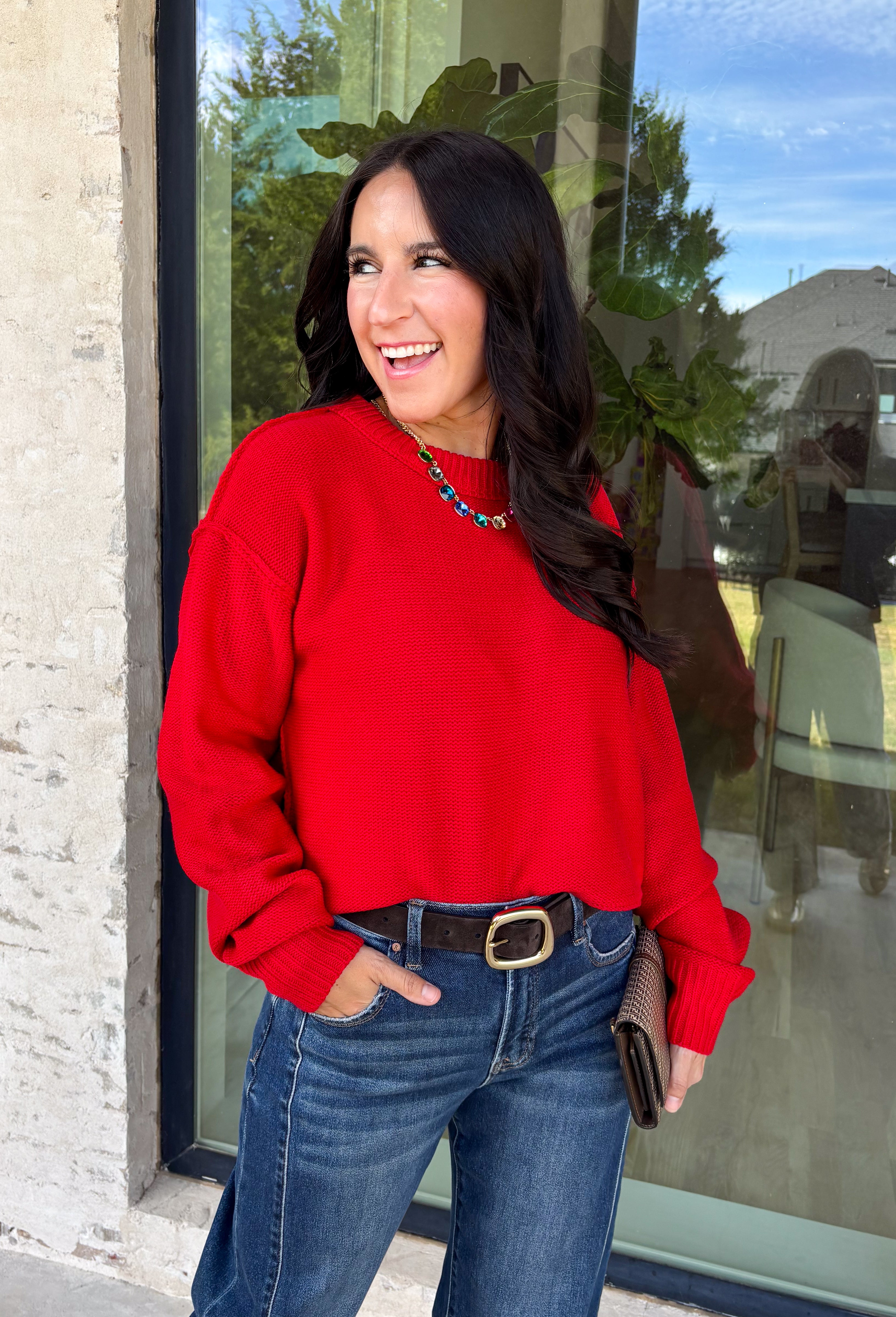 Nothing says cozy season like a classic red sweater, and this timeless knit from Double Zero is one you'll reach for again and again. Designed in a rich red hue, this effortlessly versatile sweater features exposed seam detailing that adds a modern touch to its classic silhouette. Ribbed trim at the neckline and cuffs provides a polished finish, while the soft knit construction keeps you warm and comfortable all day long. 