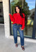 Nothing says cozy season like a classic red sweater, and this timeless knit from Double Zero is one you'll reach for again and again. Designed in a rich red hue, this effortlessly versatile sweater features exposed seam detailing that adds a modern touch to its classic silhouette. Ribbed trim at the neckline and cuffs provides a polished finish, while the soft knit construction keeps you warm and comfortable all day long. 