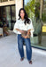 Meet the lightweight denim layer your wardrobe has been waiting for. This ecru short sleeve jacket from Entro gives classic denim a fresh update with a soft neutral shade and an easy draped silhouette. Snap buttons down the front keep the look casual, while chest pockets and additional front pockets add plenty of functional detail. Snap button closures at the sides give the design an unexpected finishing touch and add to its relaxed shape. 