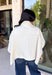 Meet the lightweight denim layer your wardrobe has been waiting for. This ecru short sleeve jacket from Entro gives classic denim a fresh update with a soft neutral shade and an easy draped silhouette. Snap buttons down the front keep the look casual, while chest pockets and additional front pockets add plenty of functional detail. Snap button closures at the sides give the design an unexpected finishing touch and add to its relaxed shape. 