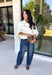 Meet the lightweight denim layer your wardrobe has been waiting for. This ecru short sleeve jacket from Entro gives classic denim a fresh update with a soft neutral shade and an easy draped silhouette. Snap buttons down the front keep the look casual, while chest pockets and additional front pockets add plenty of functional detail. Snap button closures at the sides give the design an unexpected finishing touch and add to its relaxed shape. 