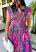 Bring a beautiful blend of color to your fall wardrobe with this eye-catching abstract print midi dress. Designed with a vibrant mix of autumn-inspired hues, this dress offers the perfect balance of playful style and timeless elegance. The flattering v-neckline is accented by a front zipper closure for a modern touch, while the defined waistband and smocked back waist create a comfortable, flattering fit. 