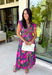 Bring a beautiful blend of color to your fall wardrobe with this eye-catching abstract print midi dress. Designed with a vibrant mix of autumn-inspired hues, this dress offers the perfect balance of playful style and timeless elegance. The flattering v-neckline is accented by a front zipper closure for a modern touch, while the defined waistband and smocked back waist create a comfortable, flattering fit. 
