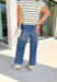 A little retro, a lot of comfort—these medium wash high-rise wide leg jeans from Lovervet are made for effortless fall styling. The high-rise fit flatters your waist, while the wide leg creates a laid-back yet polished silhouette. Oversized pockets add a trendy utility touch, and the soft cotton blend with a hint of stretch keeps them comfortable from morning errands to evening plans. Dress them up or down—either way, they’re a season-to-season keeper.