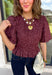 Add a playful touch to your fall wardrobe with this charming top from Entro. Designed in a rich plum hue with a light pink polka dot print, this feminine blouse is both timeless and fun. The smocked bodice creates a flattering, comfortable fit, while the puff sleeves add the perfect touch of romantic charm. Crafted from breathable cotton, this versatile top is easy to dress up for work or pair with denim for an effortless everyday look.