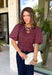 Add a playful touch to your fall wardrobe with this charming top from Entro. Designed in a rich plum hue with a light pink polka dot print, this feminine blouse is both timeless and fun. The smocked bodice creates a flattering, comfortable fit, while the puff sleeves add the perfect touch of romantic charm. Crafted from breathable cotton, this versatile top is easy to dress up for work or pair with denim for an effortless everyday look.