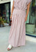 Soft pink meets warm brown in this charming midi skirt from Day + Moon. Featuring a classic stripe print, this feminine skirt brings a fresh pop of color to your fall wardrobe while still feeling easy and versatile. A zipper closure creates a clean, polished finish, while the midi length makes it perfect for everything from workdays and brunch dates to seasonal gatherings.