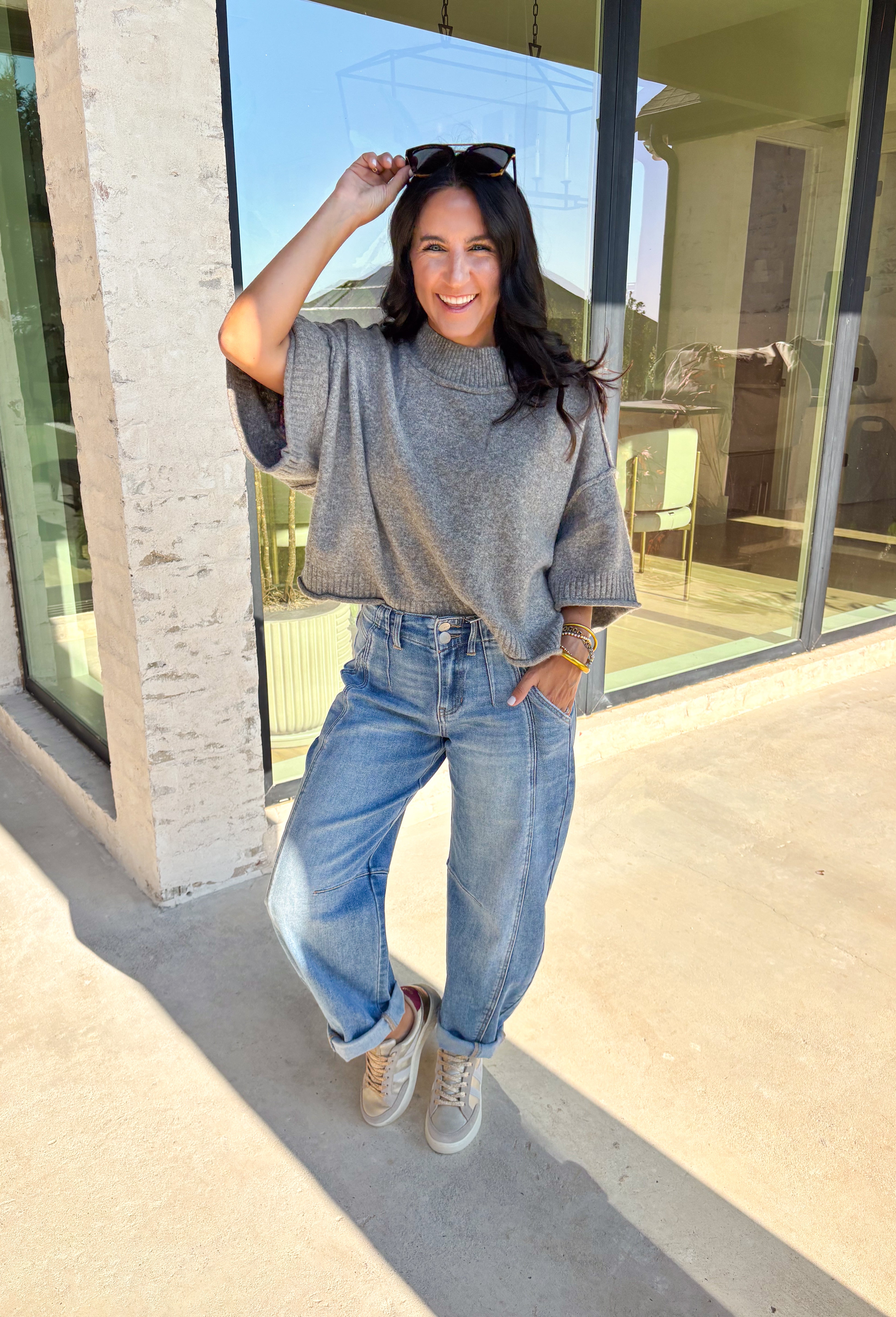 Cozy with a modern edge, this charcoal brown sweater is an easy go-to for cooler days. Designed with a mock neck and cropped length, it’s finished with exposed seam details that add a casual, laid-back vibe. Ribbed cuffs and hem bring structure to the soft knit, while the lightweight blend makes it perfect for layering. A versatile piece that pairs effortlessly with denim, skirts, or wide-leg pants for fall.