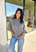 Cozy with a modern edge, this charcoal brown sweater is an easy go-to for cooler days. Designed with a mock neck and cropped length, it’s finished with exposed seam details that add a casual, laid-back vibe. Ribbed cuffs and hem bring structure to the soft knit, while the lightweight blend makes it perfect for layering. A versatile piece that pairs effortlessly with denim, skirts, or wide-leg pants for fall.