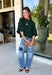 Cozy with a modern edge, this forest green sweater is an easy go-to for cooler days. Designed with a mock neck and cropped length, it’s finished with exposed seam details that add a casual, laid-back vibe. Ribbed cuffs and hem bring structure to the soft knit, while the lightweight blend makes it perfect for layering. A versatile piece that pairs effortlessly with denim, skirts, or wide-leg pants for fall.