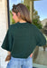Cozy with a modern edge, this forest green sweater is an easy go-to for cooler days. Designed with a mock neck and cropped length, it’s finished with exposed seam details that add a casual, laid-back vibe. Ribbed cuffs and hem bring structure to the soft knit, while the lightweight blend makes it perfect for layering. A versatile piece that pairs effortlessly with denim, skirts, or wide-leg pants for fall.