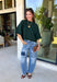 Cozy with a modern edge, this forest green sweater is an easy go-to for cooler days. Designed with a mock neck and cropped length, it’s finished with exposed seam details that add a casual, laid-back vibe. Ribbed cuffs and hem bring structure to the soft knit, while the lightweight blend makes it perfect for layering. A versatile piece that pairs effortlessly with denim, skirts, or wide-leg pants for fall.