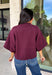 Rich wine color meets cozy knit texture in this short sleeve sweater from &amp; Merci. The deep seasonal shade makes it an easy way to add a little color to your cooler-weather wardrobe while still pairing beautifully with denim and neutral bottoms. A mock neckline gives it a classic finish, while exposed hems add a relaxed, lived-in touch. Ribbed detailing along the neckline, sleeve cuffs, and hem completes the look and adds extra texture throughout. 