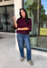 Rich wine color meets cozy knit texture in this short sleeve sweater from &amp; Merci. The deep seasonal shade makes it an easy way to add a little color to your cooler-weather wardrobe while still pairing beautifully with denim and neutral bottoms. A mock neckline gives it a classic finish, while exposed hems add a relaxed, lived-in touch. Ribbed detailing along the neckline, sleeve cuffs, and hem completes the look and adds extra texture throughout. 