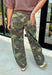 Give your everyday denim collection a bold update with these on-trend camo barrel jeans. Designed in a classic green camouflage print, these statement jeans combine effortless style with all-day comfort for a look that's equal parts laid-back and fashion-forward. The relaxed barrel leg silhouette offers a modern fit you'll love, while the adjustable self-tie belt cinches the waist for a flattering finish. 