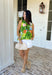 This sleeveless tropical print top is bringing all the vacation-ready energy! With its mix of green palm leaves and vibrant floral tones in blue, pink, orange, and white, it’s the kind of piece that instantly brightens your outfit. The open back detail adds a fun, unexpected twist that feels perfect for warm summer days and nights. Lightweight and breezy, it pairs effortlessly with denim shorts, white jeans, or a flowy skirt. 