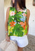 This sleeveless tropical print top is bringing all the vacation-ready energy! With its mix of green palm leaves and vibrant floral tones in blue, pink, orange, and white, it’s the kind of piece that instantly brightens your outfit. The open back detail adds a fun, unexpected twist that feels perfect for warm summer days and nights. Lightweight and breezy, it pairs effortlessly with denim shorts, white jeans, or a flowy skirt. 